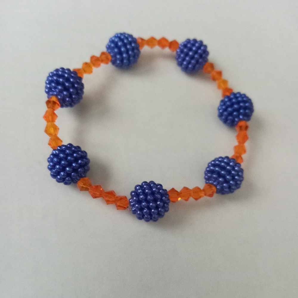 Hand crafted new orange iridescent crystals and blue berry statement bracelet